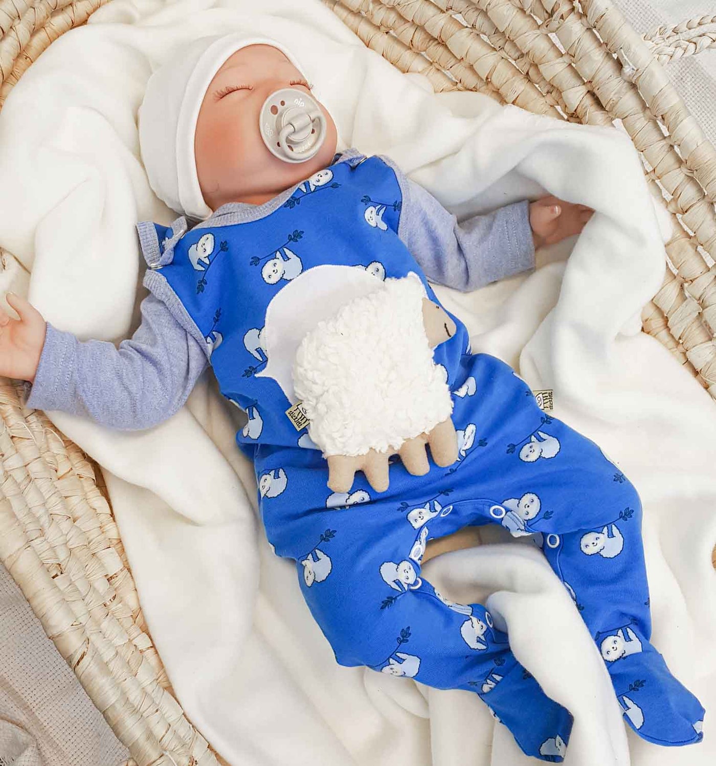 Baby-Strampler in royalblau mit Faultieren | sticklett Online Store.
