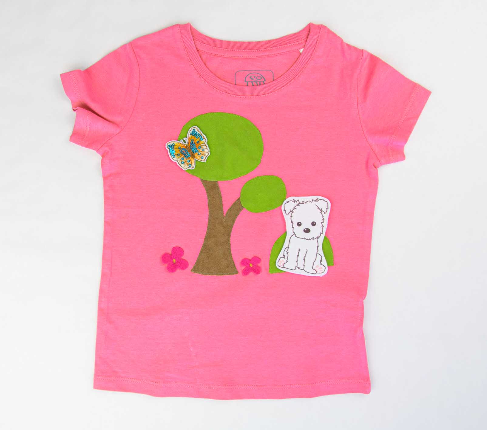 Mädchen T-Shirt in Pink mit aufgenähtem Garten Bild | sticklett Online Store.